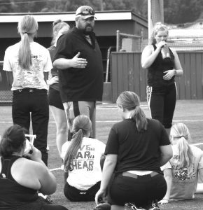Third-year head coach Ben Locke addresses the Lady Owls’ softball players during a recent practice. Locke’s squad has several starters returning from last year. The Lady Owls open the season with the Marshall Invitational on Saturday, Aug. 27. Hobby King/Democrat-News