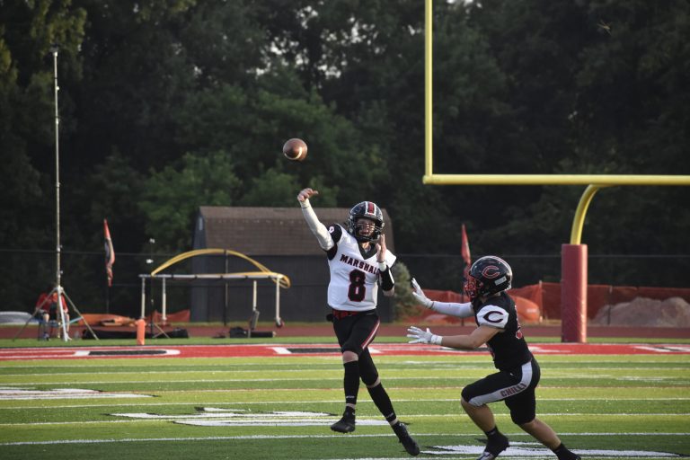 Marshall junior quarterback Jaxson Case (left) was under pressure a lot while throwing the ball versus Chillicothe in the opener. Case was 12 of 23 for 84 yards. He hopes to get better protection when the Owls host Boonville for their home opener at 7 p.m. Friday. Hobby King/Democrat-News