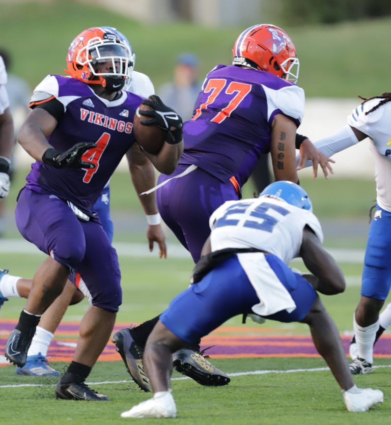 Viking junior Jaleen Jones (4) leaped over Peru State sophomore defensive back Abdias Metelus en route to a 51-yard touchdown scamper. Jones led the Valley rushers with 88 yards in the 16-6 victory. Jones and Vikings play at Clarke University in Duduque, Iowa, at 1 p.m. Saturday. Photo courtesy Gary Bedell Jr.