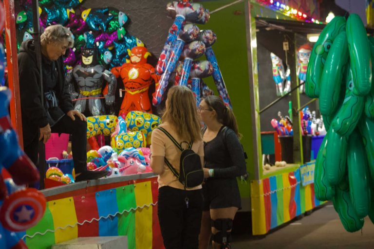 Two girls visit a game booth at the 2021 Slater Fall Festival. MDN file photo