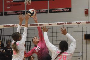 Marshall senior Marissa Tobar (20) attempts a kill over a double block attempt of the Mexico Lady Bulldogs. Tobar and the Lady Owls registered their first win of the season in four sets Thursday. The Lady Owls won their first match of the season in four sets. Hobby King/Democrat-News