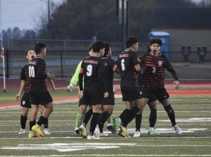 Marshall players celebrate after sophomore Danis Alvarez (6) netted the game’s first goal. Alvarez later scored the game-winner with 2:03 left in the first overtime, lifting the Owls to a 2-1 win over Odessa in the Class 2, District 6 title game at Odessa Thursday. Hobby King/Democrat-News