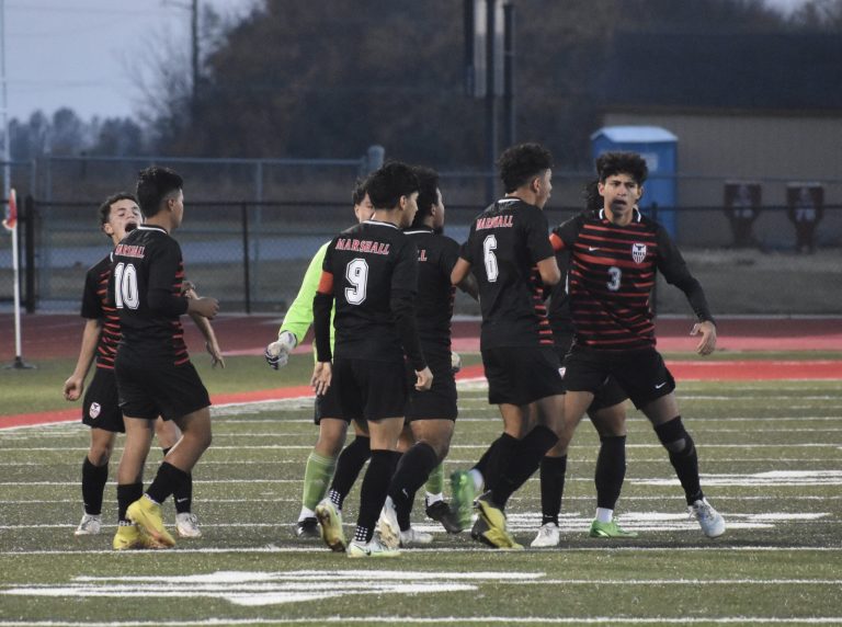 Marshall players celebrate after sophomore Danis Alvarez (6) netted the game’s first goal. Alvarez later scored the game-winner with 2:03 left in the first overtime, lifting the Owls to a 2-1 win over Odessa in the Class 2, District 6 title game at Odessa Thursday. Hobby King/Democrat-News