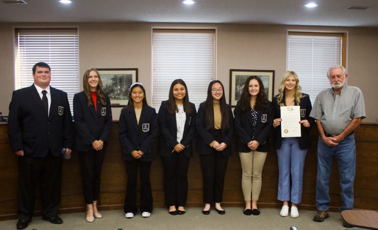 Marshall Mayor Dewey Hendrix reads a proclamation for DECA Month on Tuesday morning, Nov. 1. The proclamation was presented to the Saline County Career Center DECA chapter at 11:45 a.m. Pictured left to right are: Devin Hughes; Gentrie Davis; Jaedyn Borja; Kaylen Alvarez; Michelle Lin; Avery Evans; Bailey Kueker, SCCC DECA president and SAT officer; and Hendrix. Danielle Linton-Hatfield/Democrat-News