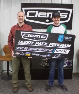 Mark Clemons (right), with Clem’s Sign, presents this year’s Buddy Pack Program check on Thursday afternoon, Jan. 19. Receiving the check was Darren White (left), regional coordinator manager for The Food Bank for Central and Northeast Missouri. This year 77 children in the Saline County area will benefit from the $21,030 that was raised toward the program. Danielle Linton-Hatfield/Democrat-News