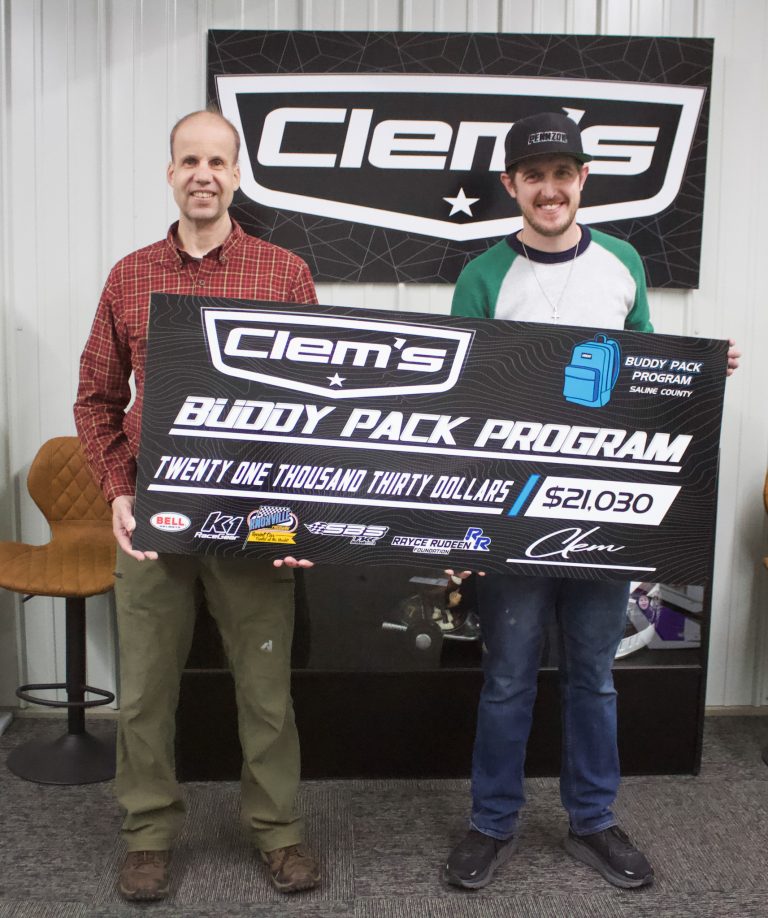 Mark Clemons (right), with Clem’s Sign, presents this year’s Buddy Pack Program check on Thursday afternoon, Jan. 19. Receiving the check was Darren White (left), regional coordinator manager for The Food Bank for Central and Northeast Missouri. This year 77 children in the Saline County area will benefit from the $21,030 that was raised toward the program. Danielle Linton-Hatfield/Democrat-News