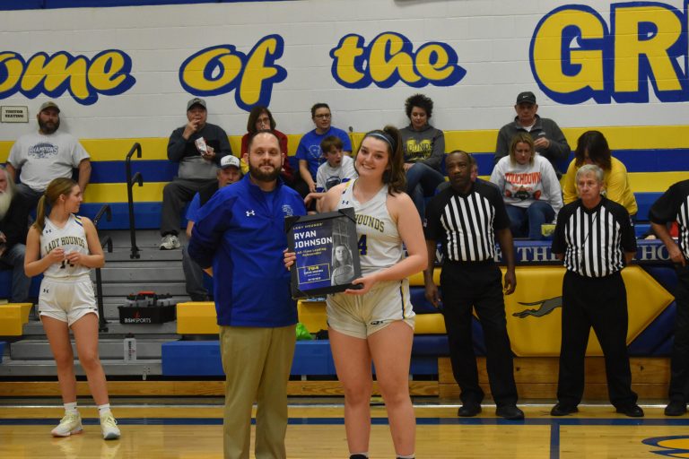 Prior to the Sweet Springs- Lone Jack girls game Friday, senior Ryan Johnson (right) was honored for setting the all-time rebound record for the Lady Greyhounds. With her 11th board versus Southwest-Livingston Jan. 18, Johnson took over the No. 1 position on the list with 794 career boards. Brittany Higgins (2008-12) had held the record with 793. Pictured with Johnson is Lady ‘Hounds’ head coach Brent Niemeyer. (Hobby King/Democrat-News)