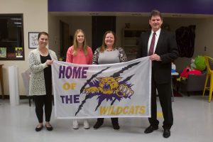On Thursday, Jan. 19, Slater School Board sees a sample of the new school district flag design. The flag design was made by Web Design student Kenna Lemmon. Pictured left to right are: Slater High School Principal Jessica Clements; Lemmon; Rita Shaw, business instructor; and Superintendent Terry Lorenz. Danielle Linton-Hatfield/Democrat-News