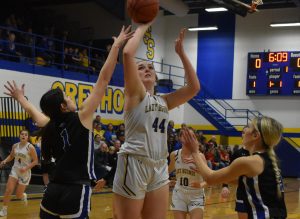 Sweet Springs senior Ryan Johnson (44) attempts to score two points versus Lone Jack on Jan. 20. Johnson became the eighth player in Lady Greyhounds’ history to accumulate 1,000 career points versus Orrick Tuesday night. (Hobby King/Democrat-News )
