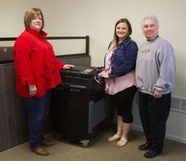 Saline County Clerk Brittni Allison Burton (middle) holds a public test for voting equipment prior to Election Day on Thursday, March 30. Judy Borges (left), Republican representative, and Pam LaFrenz (right), Democrat representative, are sworn in and the chosen bi-partisan team that participates in the test. Danielle Linton-Hatfield/Democrat-News