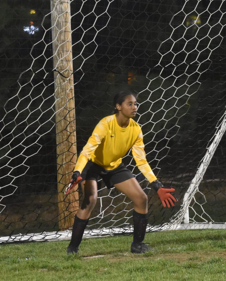 Marshall freshman goalkeeper Ja'Lee Standley prepares to try to stop a penalty kick from a Moberly player. Standley starred in the PK, stopping two Lady Spartans' shots in a 2-1 (3-2 PKs) NCMC victory Thursday at MHS. (Hobby King/Democrat-News)