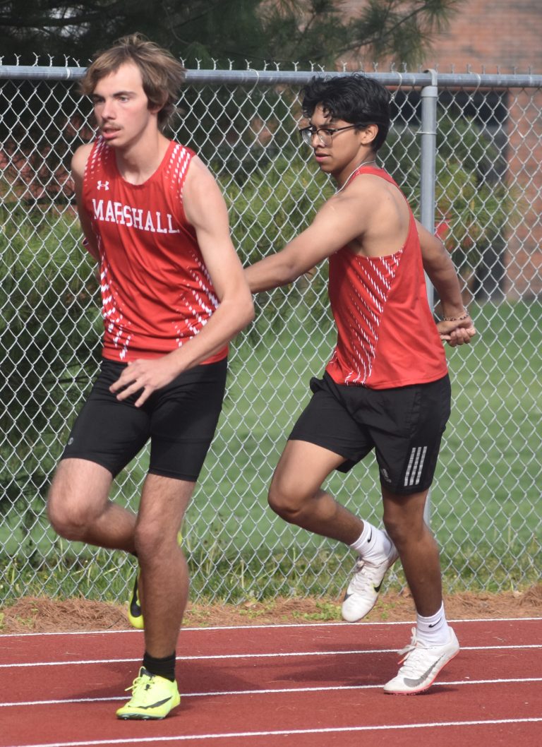 MHS freshman Santiago Rodriguez (right) makes a clean hand-off to sophomore Shawn Hensley in the 4x200-meter relay. The Marshall quartet of junior Joshua Sandoval, junior Adrian De La Torre Jr., Rodriguez and Hensley won the event in 1 minute, 43 seconds, two seconds better than a Holden foursome. (Hobby King/Democrat-News)