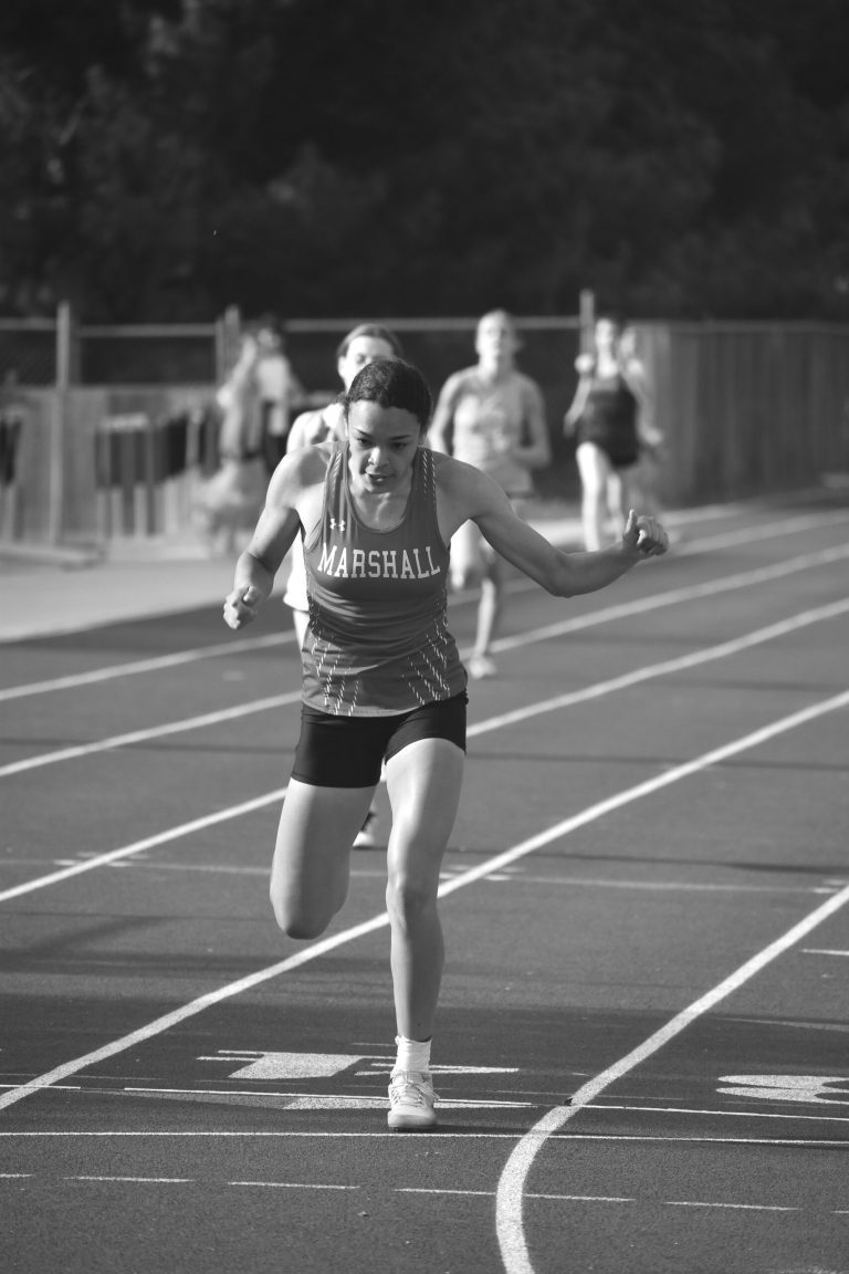 Marshall sophomore Shelley Thompson crosses the finish line ahead of the field in the 400-meter dash. Thompson won the event in 1 minute, 7.28 seconds and the triple jump at 9.67 meters. (Hobby King/Democrat-News)