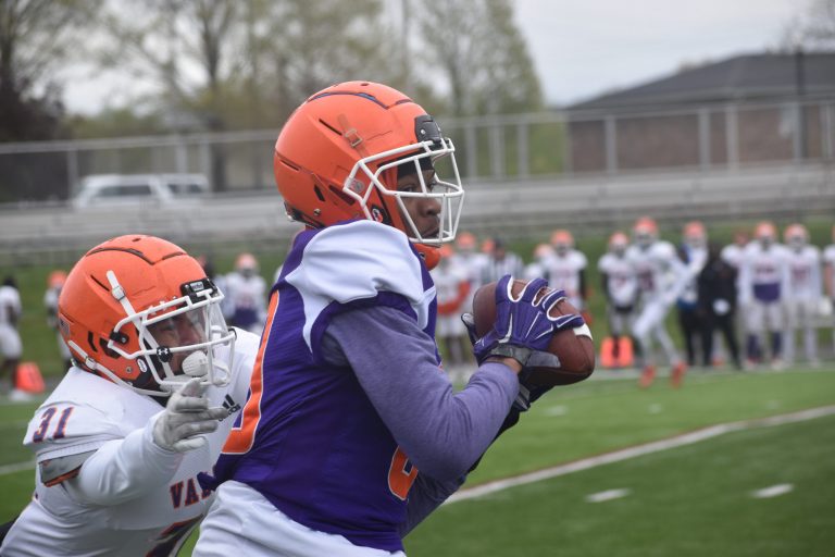 In weather conditions much more like November than late April, the Missouri Valley College Vikings played their Spring Game Saturday on Gregg-Mitchell Field in Marshall. (Above) Senior wide receiver Dorian Miles (right) catches a pass with sophomore defensive back Kaden Khammanivong defending. (Below) Freshman running back Cortez Williams (43) breaks a tackle, while junior linebacker Abel Clark (30) and senior defensive back Johnny Bailey (20) close into try to bring him down. The scrimmage culminated three weeks of spring practices. The Vikings, coming off a 3-8 season, report for fall practice in early August. There will be changes in the Heart of America Athletic Conference this season, Evangel is leaving, and Missouri Baptist is coming in to play football and men’s volleyball. The Heart decided to drop the first cross-divisional games, allowing league teams to play a non-conference game on Aug. 26. But, at this time, Valley does not have an opponent scheduled for that week. Valley will not be playing Clarke in 2023. As of now, the Vikings will open the season Sept. 2 with a home game versus Culver-Stockton. (Hobby King/Democrat-News)