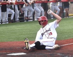 Owl junior Aiden Coffman slides across home plate with one of Marshall's three runs in the fourth inning. Coffman scored twice, but the Owls came up short, 6.4. (Hobby King/Democrat-News)