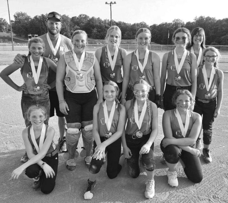 The Sweet Springs North American Medical softball team won the LaCoMo East Major League postseason tournament title. Pictured (from left): front, Zoey Lock, Evalyn Hudson, Hadley Eichholz, Reagan Lee; middle, Madisen Guier, Riley Hartline, Josephine Reinke, Kasey Hartline, Ella Black, Braelyn Johnson; back, coaches Mitchell Guier and Kristy Johnson. (Contributed image)