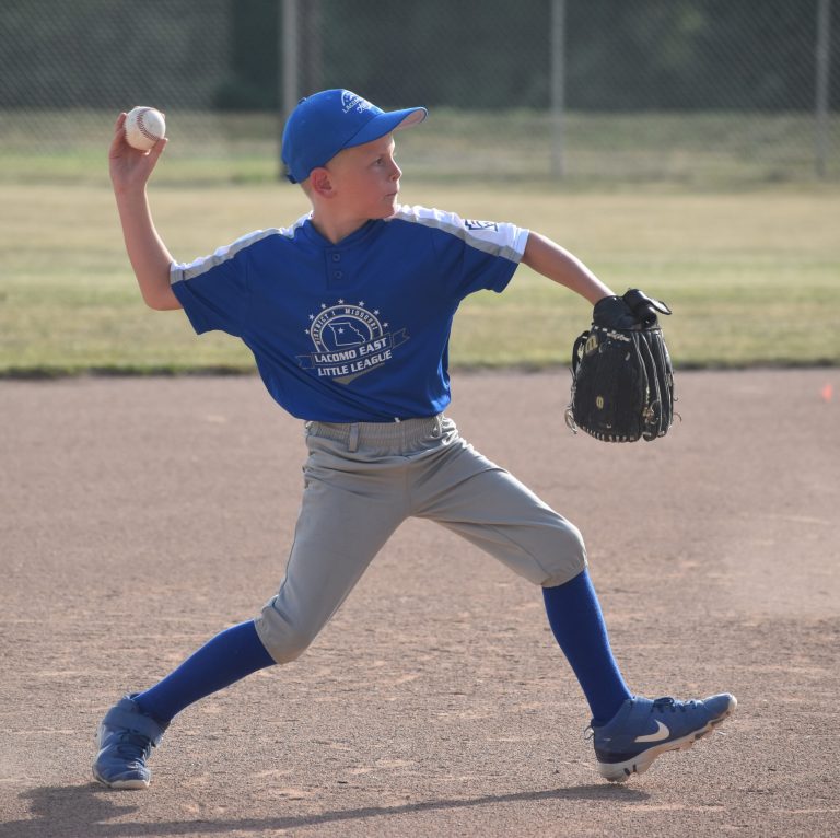 LaCoMo East 9U shortstop Jayden Bredehoeft throws out a Northwest Missouri runner Thursday night. LaCoMo East won the first-round district game 27-9 in Marshall. (Hobby King/Democrat-News)
