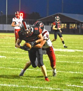 Marshall senior Jaxson Case rushed for 165 yards and three TDs, leading the Owls to a 19-13 victory over the Chillicothe Hornets Friday. (Hobby King/Democrat-News)