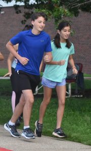 Freshmen Teddy Papreck (left) and Melissa Reyes start off their practice run for the Marshall High School cross country teams. The Owls and Lady Owls begin their season at Grain Valley Monday, Aug. 28. (Hobby King/Democrat-News)