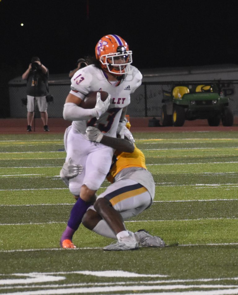 Valley senior Adyn Schwarzer (13) picked off one of two passes in the final three minutes to preserve the Vikings’ 33-28 win at William Penn Saturday night. (Hobby King/Democrat-News)