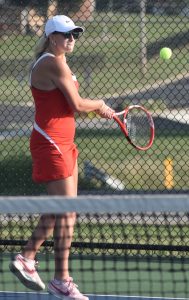 Lady Owl senior Bailey Kueker returns a ball during a recent match. Kueker won three of her four matches played (singles and doubles, with senior Alizah Russell) versus Helias Catholic and Hannibal. (File Photo — Hobby King/Democrat-News)