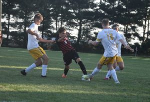 Marshall junior Brian Garcia (6) gets past a Fulton defender and scores the Owls’ first goal in a 6-0 shutout victory. (Hobby King/Democrat-News)