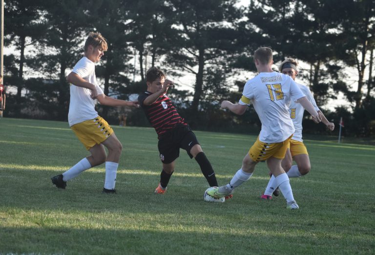 Marshall junior Brian Garcia (6) gets past a Fulton defender and scores the Owls’ first goal in a 6-0 shutout victory. (Hobby King/Democrat-News)