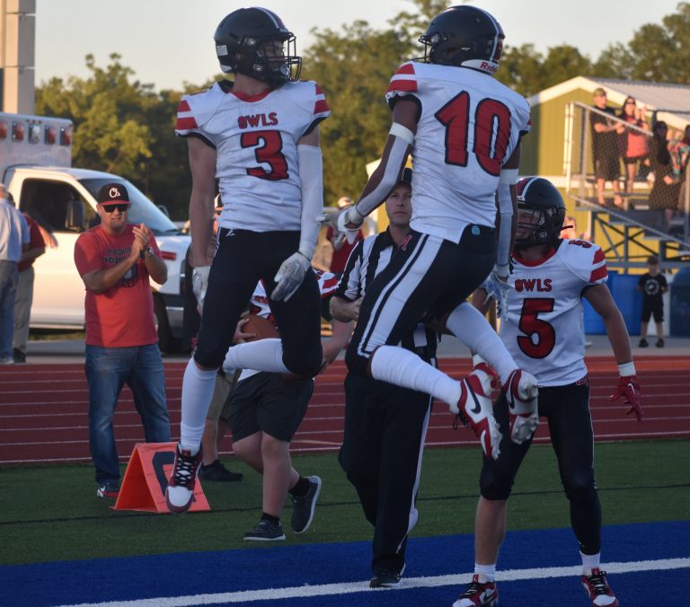Seniors Stephen Caviness (3) and Jayden Dominique (10) celebrate after Caviness scored a TD, tying the game 7-7. The Owls led 14-7 at the half, but Boonville scored five second-half TDs, en route to a 42-20 win. (Hobby King/Democrat-News)