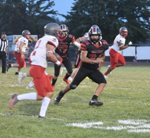 Owl junior linebacker Mason Evans (24) tracks Mexico sophomore running back Drew DeMint. Evans finished the game with 12 total tackles on defense and 59 yards rushing on offense. (Hobby King/Democrat-News)