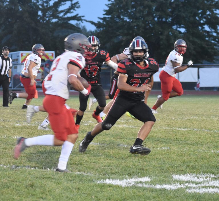 Owl junior linebacker Mason Evans (24) tracks Mexico sophomore running back Drew DeMint. Evans finished the game with 12 total tackles on defense and 59 yards rushing on offense. (Hobby King/Democrat-News)