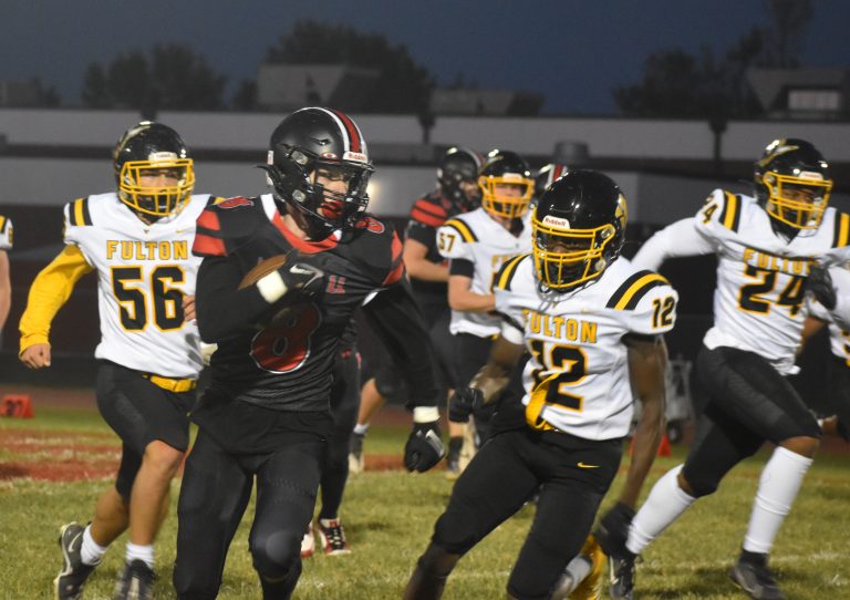 Owl senior Jaxson Case (8) breaks loose for a long run versus Fulton. Case scored two touchdowns, and ground-oriented Marshall blanked the Hornets 20-0 last Friday. (Hobby King/Democrat-News)