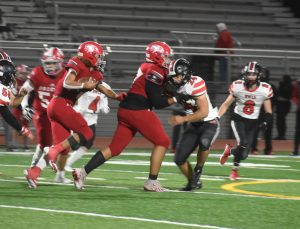 Marshall junior Mason Evans (24) tries to play off a block to get to a Falcon ball carrier. Evans rushed for 97 yards and a touchdown and totaled eight tackles, including one for a loss, in the Owls’ 24-15 win at Van Horn last Friday night. (Hobby King/Democrat-News)