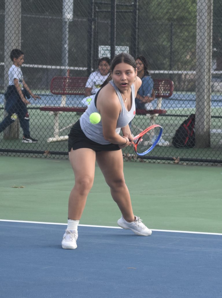 Marshall junior Kaylen Alvarez won her No. 6 singles match in a super tiebreaker, lifting the Lady Owls to a 5-4 victory over Higginsville in the Class 1, District 13 championship match Wednesday. (Hobby King/Democrat-News)