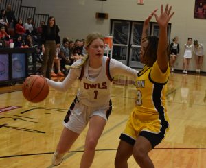 Lady Owl junior Ainsley McCracken drives to the basket. McCracken hit one of two free throws to give Marshall a late lead, en route to a 46-44 win Friday night. (Hobby King/Democrat-News)