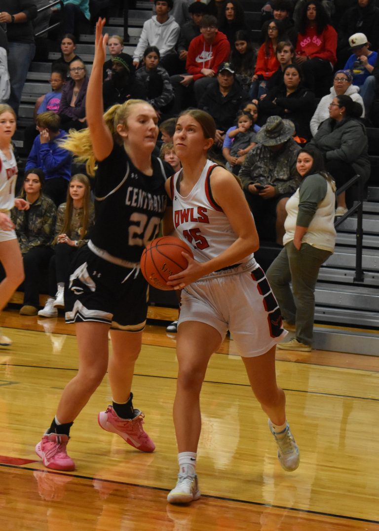 Lady Owl senior Kiki Simic (25) drives past a Centralia defender toward the basket. Simic scored 14 points in the non-conference loss. (Hobby King/Democrat-News)