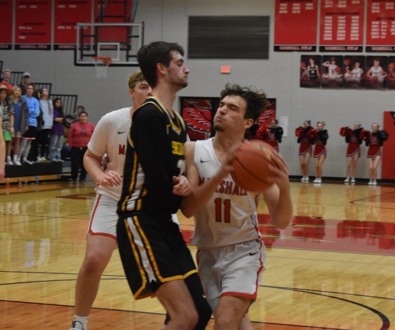 Owl senior Stephen Caviness (11) drives toward the basket versus Smith-Cotton. Caviness scored 18 points in the Owls’ first win of the season. (Hobby King/Democrat-News)