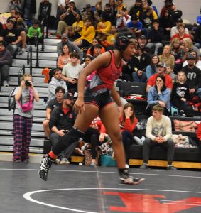 MHS senior Amaiya McClinton jumped for joy after winning the 125-pound championship match with a pin over Fulton’s Emmy Begemann. McClinton had lost to Begemann by fall in the first period of their match at the NCMC duals in Moberly four days prior. (Hobby King/Democrat-News)