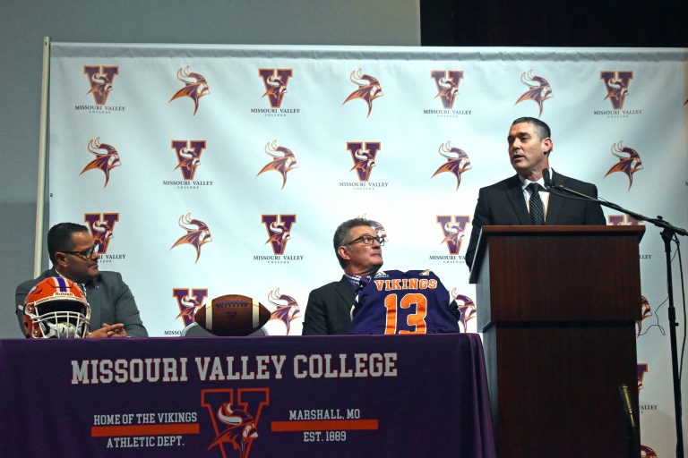 New Missouri Valley College football coach Casey Creehan (right) talks to a nearly packed house at his introduction and press conference on Wednesday, Jan. 10. Creehan is joined by MVC President Dr. Joseph Parisi (left) and Athletic Director Mike Machholz. Creehan becomes the 13th head coach in the history of the sport at Valley. He follows Paul Troth, who stepped down in November after a 22-year stint in the position. (Hobby King/Democrat-News)