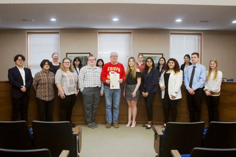 On Monday morning, Feb. 12, Marshall Mayor Vince Lutterbie proclaimed for the Saline County Career Center that Feb. 11-17 is Future Business Leaders of America Week. The following pictured in the front row (left to right) are: Randy Vazquez; Marjorie Barcenas; Syndy Shivers; Chase Staton-Secretary/Treasurer; Lutterbie; Lauren Chaney-King-President; Dianna Escarate-Vice President; Yeneda Diaz; Whit Thomas; and Piper Brunson. Pictured in the back (left to right) are: Tracy Crumbaugh-Advisor; Damaris Escarate; Ashley Turcios; Brianna Carrillo; Alexa Aguilar; and Melyi Benitez. Danielle Linton-Hatfield/Democrat-News
