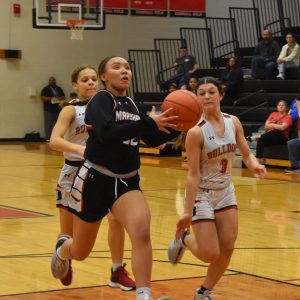 After she stole the ball near mid-court, freshman Nevaeh Campbell drives in to score two of her 13 points in the Lady Owls’ 54-52 loss to Odessa in the first round of district play Monday at MHS. (Hobby King/Democrat-News)
