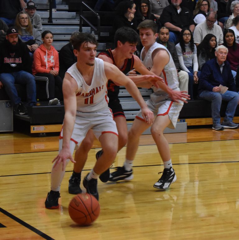 On Senior Night, Marshall senior Stephen Caviness (left) scored 17 points to lead the Owls to a 45-33 NCMC win over Hannibal last Friday. (Hobby King/Democrat-News)