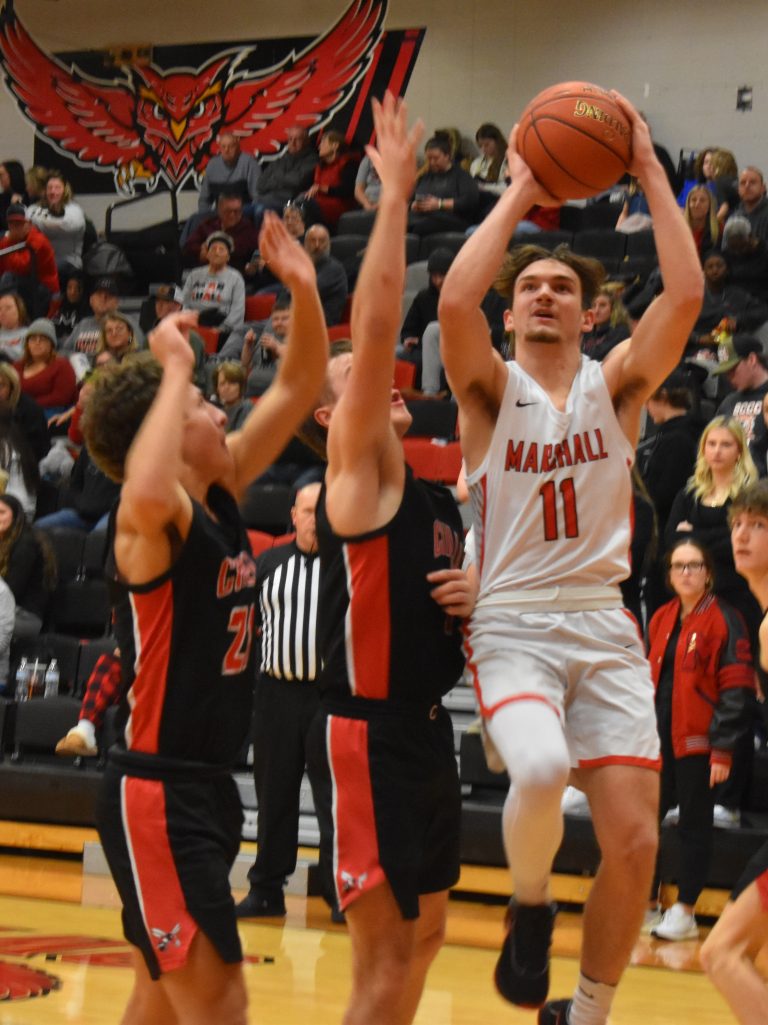 Owl senior Stephen Caviness (right) scored a game-high 22 points, including five in overtime, to lead MHS to a 66-57 OT win over Pleasant Hill. (File Photo — Hobby King/Democrat-News)