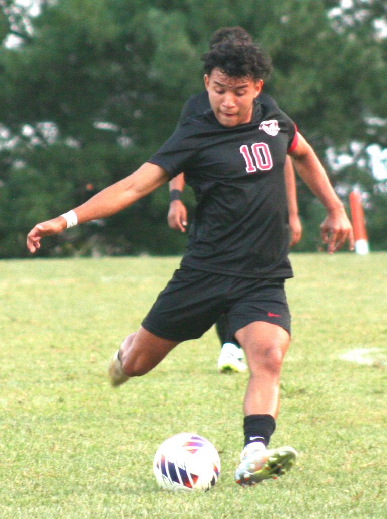 Marshall senior Danis Alvarez fires a shot at the Mexico goal. Alvarez scored two goals and assisted on another in the Owls pummeled Mexico 7-1 last week Tuesday night at the Marshall Sports Complex. (Hobby King/Democrat-News)