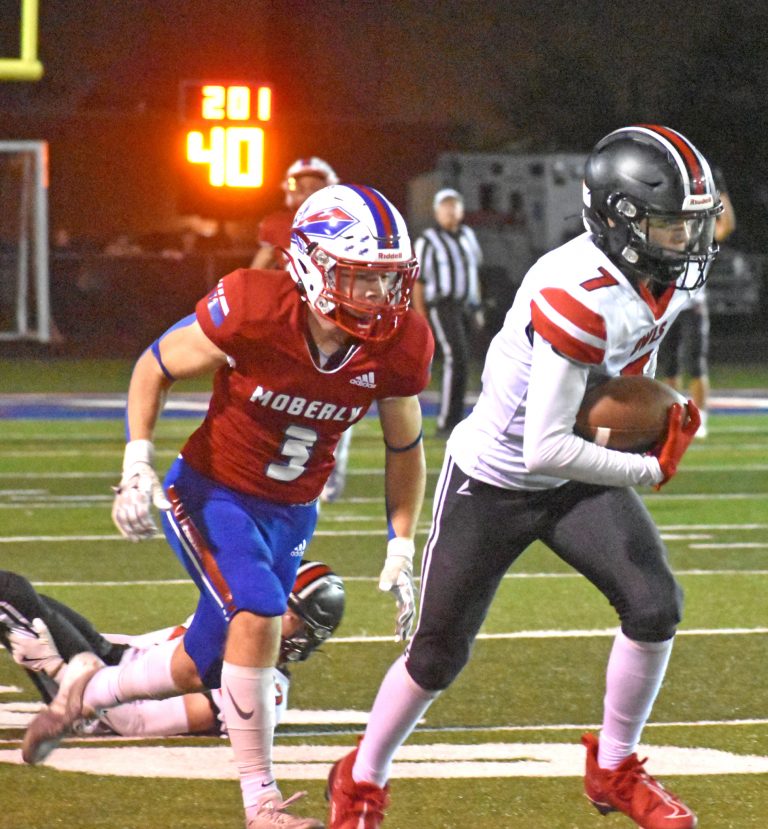 Owl sophomore Davis Wilkinson (7) runs with the ball after winning a jump ball around the Moberly 40-yard line. Wilkinson was hauled down after a 38-yard gain in the second half. The Owls lost the NCMC battle 42-8 last Friday night. (Hobby King/Democrat-News)