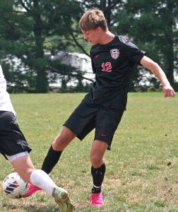 Owl senior Deacon Arends tries to get a ball away from an opponent during a recent home match. At Kirksville, Arends scored his third goal of the season in a 5-0 NCMC win on Oct. 29. (File Photo Hobby King/Democrat-News)