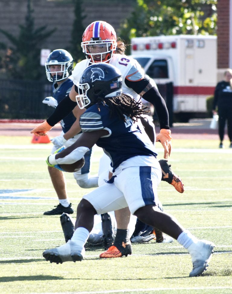 Valley senior Adyn Schwarzer (13) closes in on the Spartans’ Lionel Banks in search of a tackle. Schwarzer totaled six tackles, but the Vikings’ lost the HAAC South Division matchup 29-23 last Saturday in Creve Coeur. (Hobby King/Democrat-News)