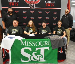 On Wednesday, Marshall senior Riley Wilkinson (front, second from left) signed a letter of intent to play softball for NCAA Division II Missouri S&T in Rolla. Pictured with her are her parents, Sherman (front, left) and Sarah (front, second from right) and her brother, Davis, as well as MHS softball head coach Ben Locke (back, left) and MHS Athletic Director Kelly Callanan. (Hobby King/Democrat-News)