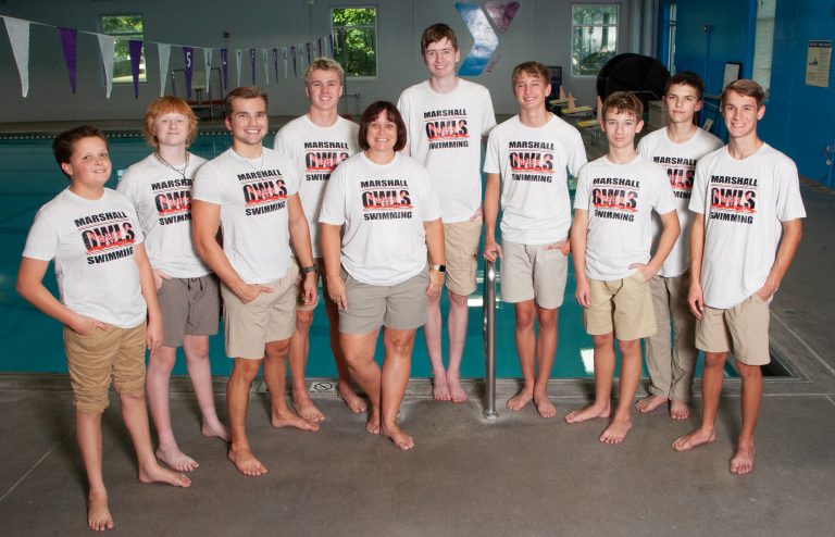 The Marshall Owls’ swim team members (from left) are: Nolan McGuire, Brecken Jones, Noah Blumhorst, Jacob Leavitt, head coach Wendy Davis, John Guthrey, Hudson Green, Kian Bossaller, Chris Sutter and Deaginn Slusher. (Photo courtesy Lee’s Studio)