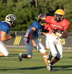 Slater’s Brandon Terrill (right) tries to make a move on a defender after catching a pass. Terrill finished the game with three catches for more than 50 yards, including a 16-yard touchdown reception — the go-ahead points in a 42-24 victory for the red Team. (Photo courtesy Rachael Quinn Davis)